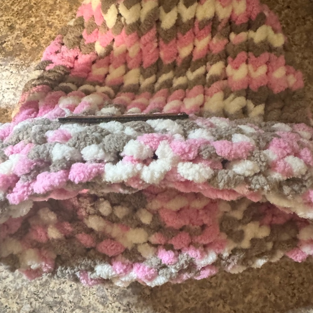 This item is a hand crochet pink, white and gray Hat for a little girl XS.